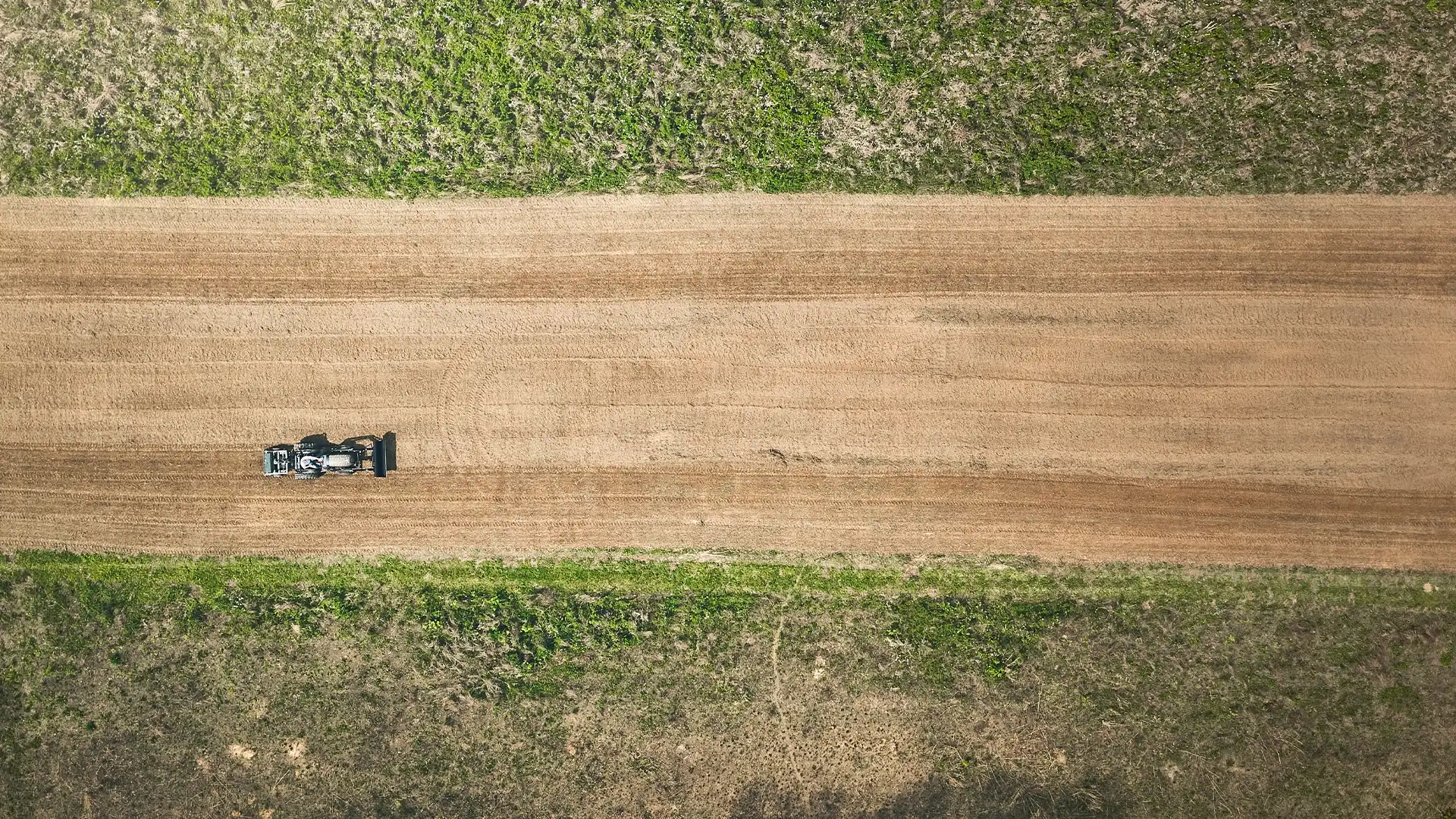 overhead shot of a tractor in a field