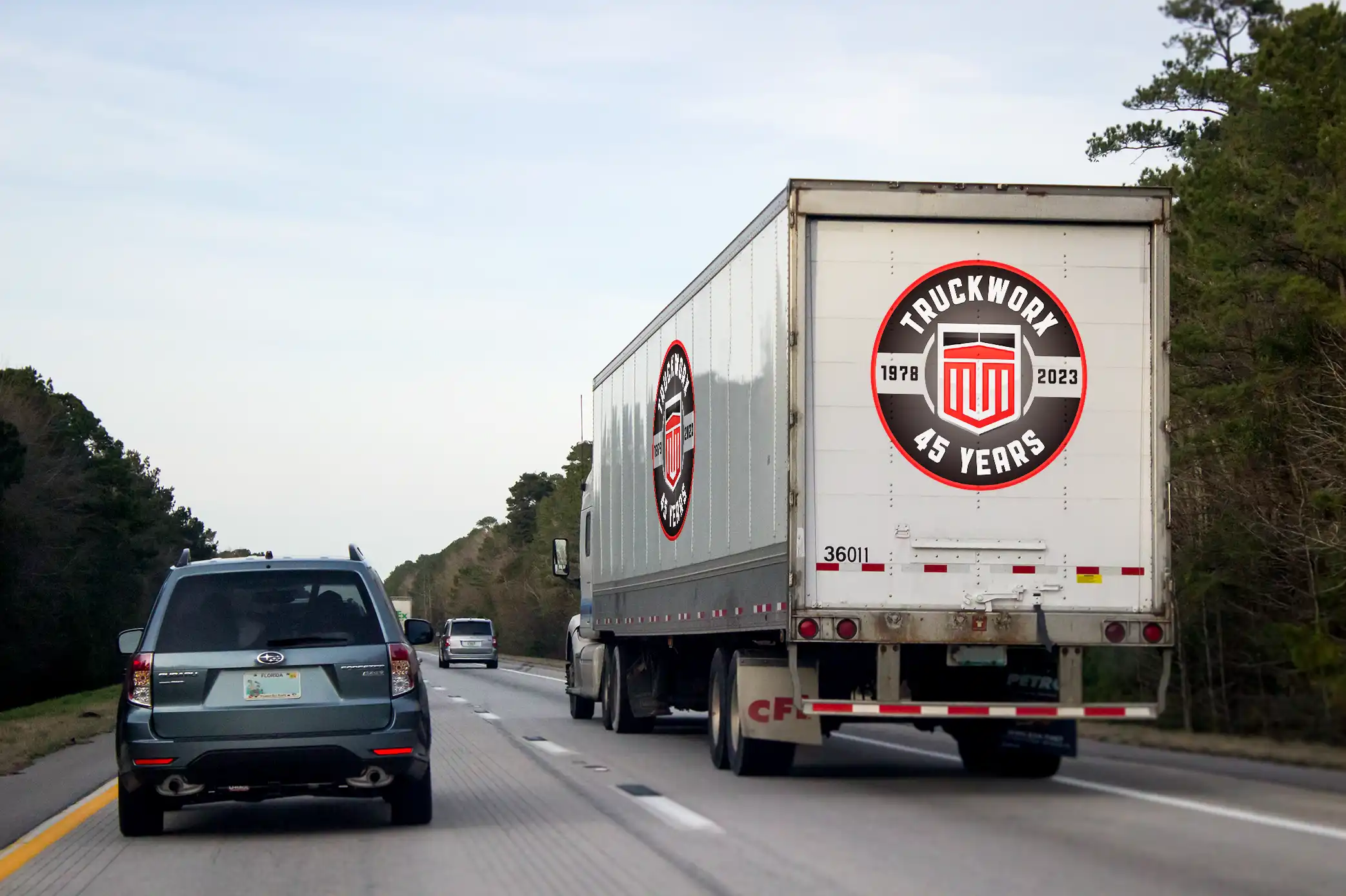 a tractor trailer with a truckworx logo on highway