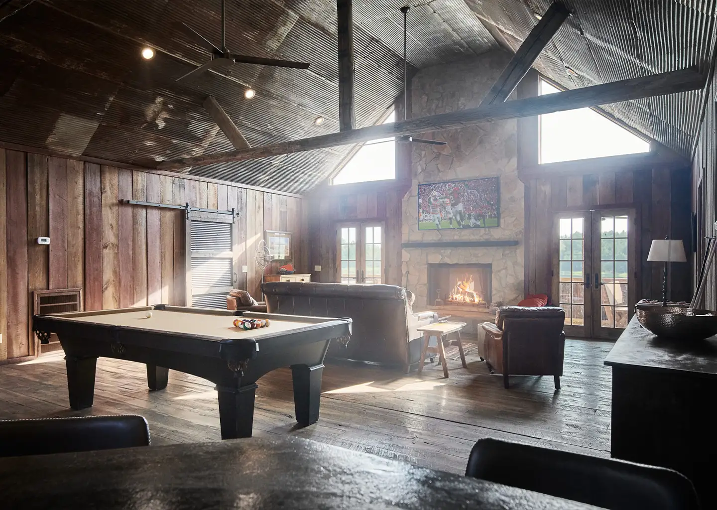 cabin picture with pool table and fireplace
